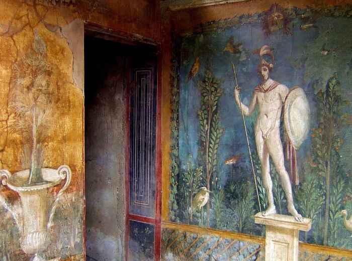 Frescoed room in Oplontis with vivid reds, greens and yellows