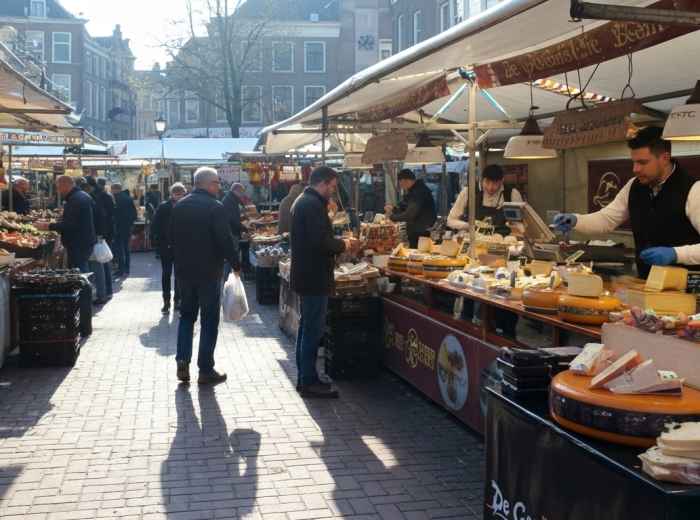 Stalls and locals at Utrecht market on Vredenburg Square