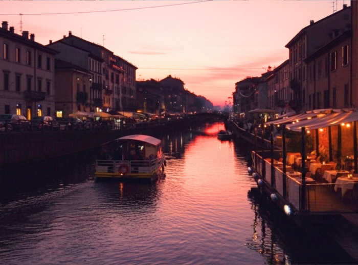Evening on the Navigli with café lights on the water