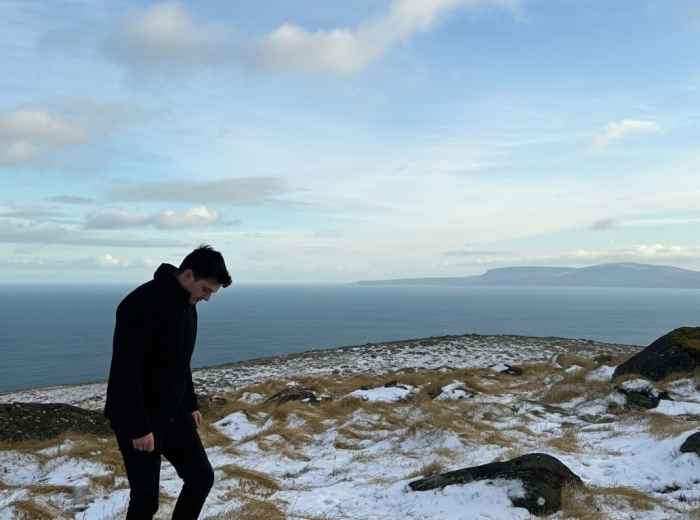 Snow-covered Wicklow Mountains and wild coastal walks along the Irish Sea
