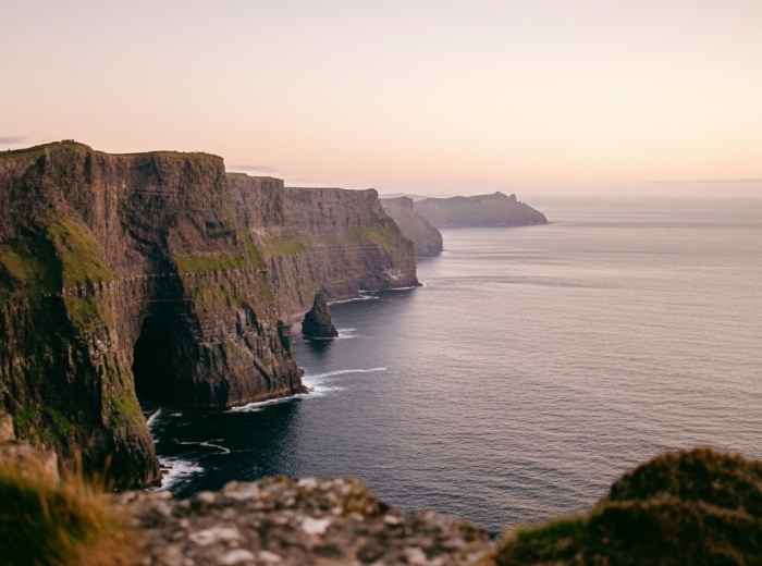 Expansive views of the Cliffs of Moher with the Atlantic and Aran Islands