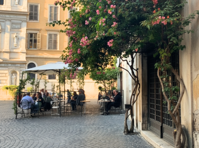 Piazza Madonna dei Monti with locals and a corner café
