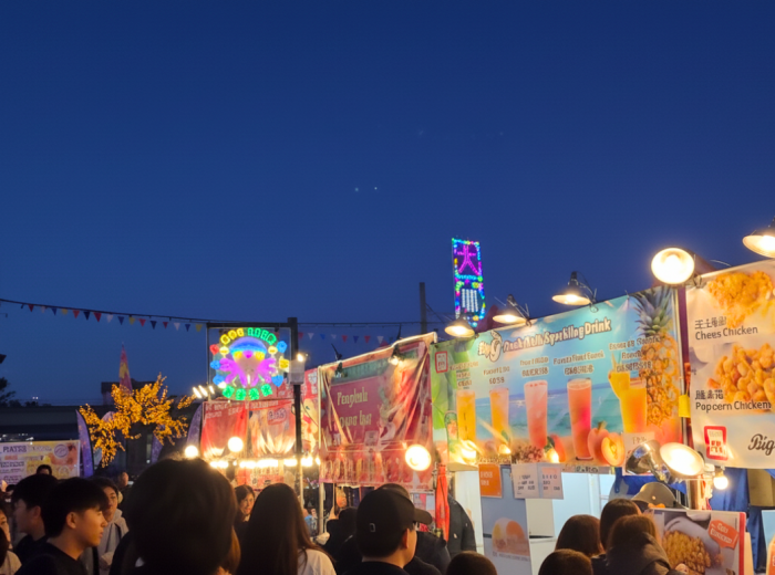 Richmond Night Market food stalls with neon lights