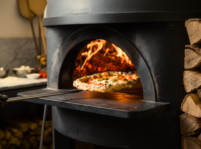 Wood fired oven glowing in a small harbor pizzeria