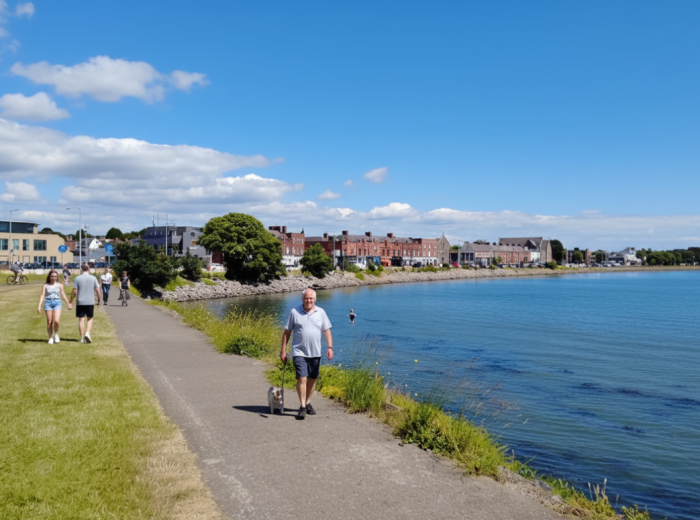 Walkers on Clontarf promenade beside Dublin Bay