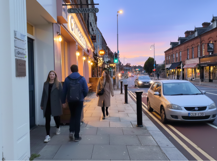 Ranelagh main street with redbrick buildings, cafes, and evening foot traffic