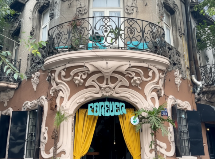 Art Deco doorway on a shaded Roma side street