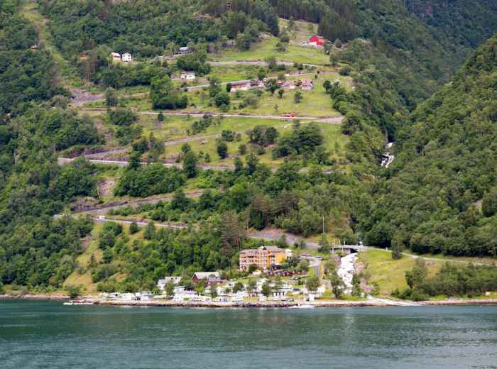 Monte Isola ferry and lakeside village with green hills