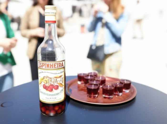 Dark red ginjinha shot from a small bar in Baixa