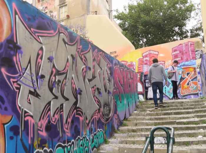 Massive murals on walls in Marvila, showcasing Lisbon's vibrant street art