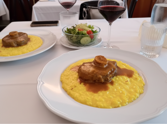 Ossobuco braised veal shank with marrow served atop creamy risotto