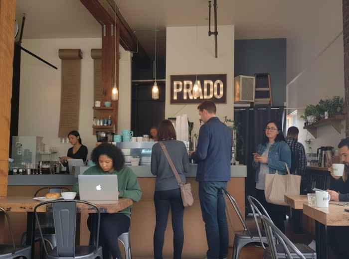 Locals standing at an espresso bar on Commercial Drive