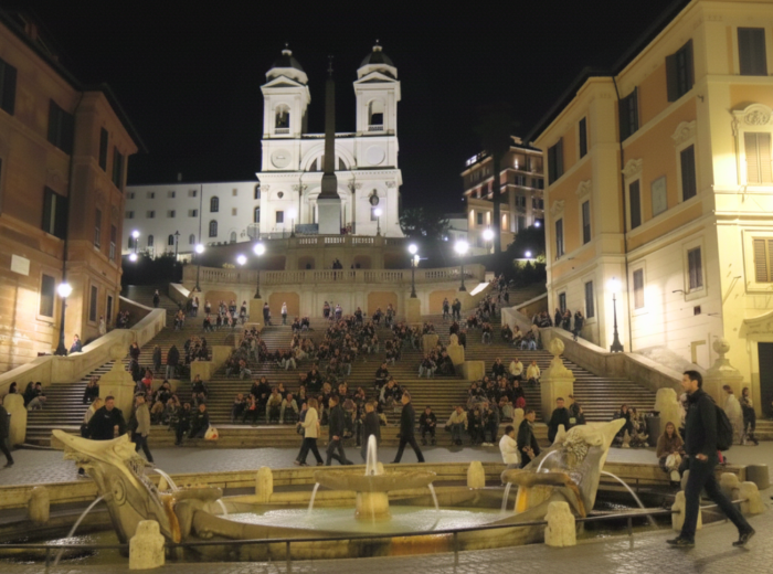 Spanish Steps with tourists sitting on the iconic staircase