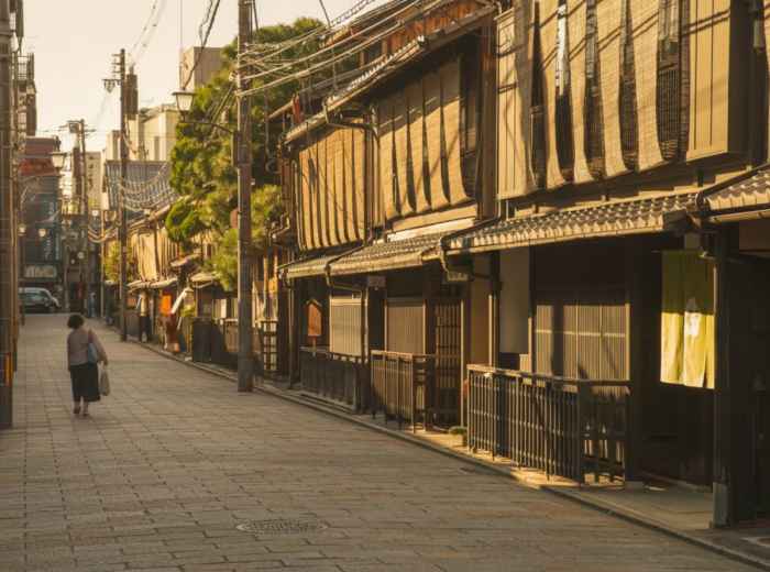 Kyoto backstreet with old wooden houses and soft afternoon light