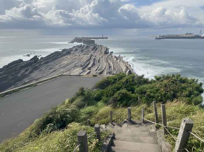 Coastal walking path along Jogashima peninsula with Pacific Ocean waves