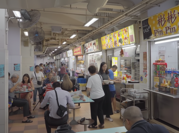 Hawker centre dinner crowd with people enjoying their food