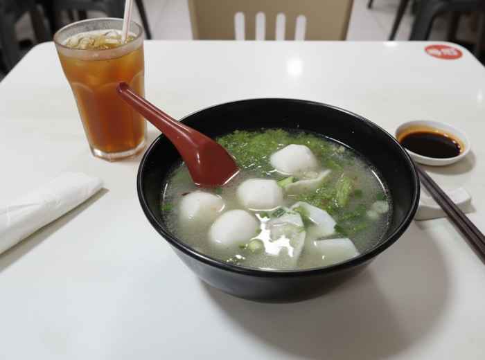 Clear fish ball noodle soup with bouncy handmade fish balls and fish cake slices