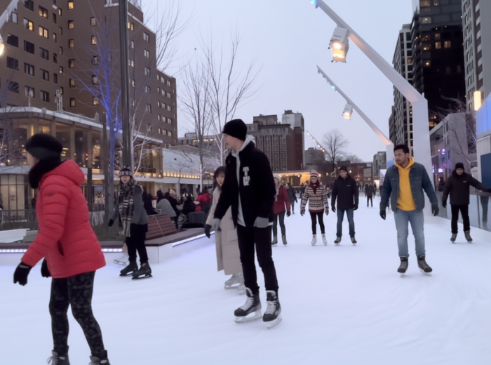 Outdoor winter skating rink with skaters 