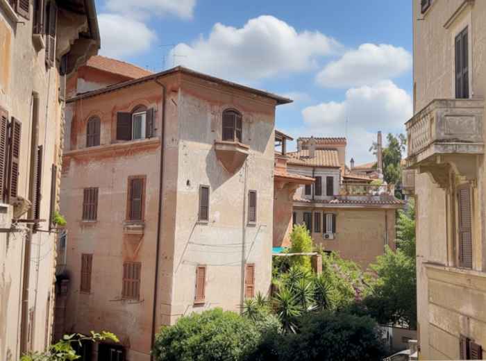 Pastel-painted art nouveau courtyard in Garbatella