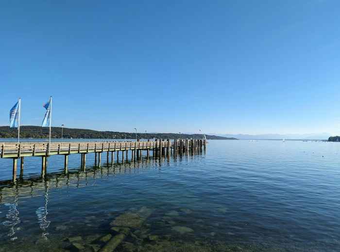 Clear waters of Lake Starnberg with Alpine mountain backdrop