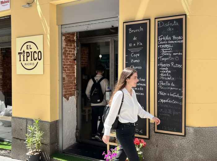 handwritten menú del día chalkboard at traditional taberna entrance