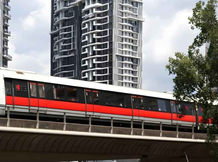 Modern MRT train at station platform with directional signage