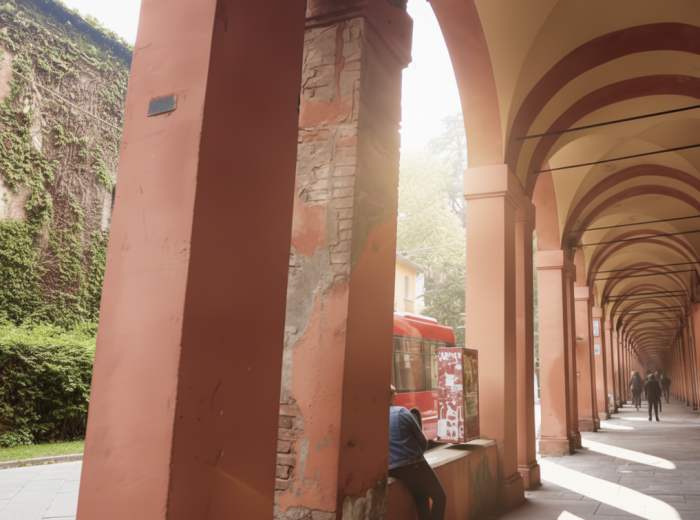 morning light streaming through Bologna porticos