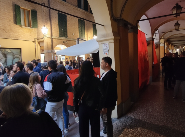 Crowded Pratello evening under porticos