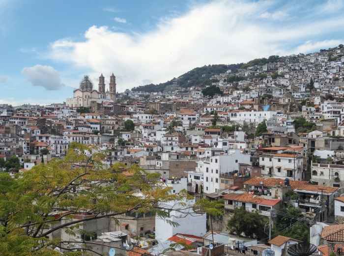 Taxco hillside of white houses and terracotta roofs