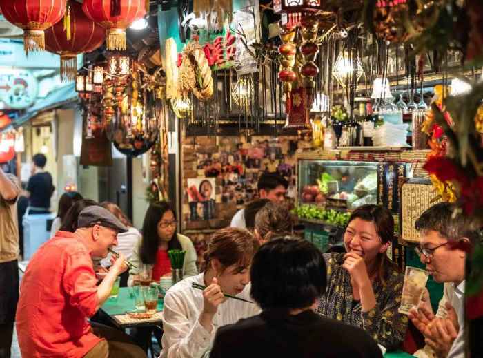 Ebisu Yokocho in Tokyo, a lively alleyway of izakayas with lanterns and locals dining