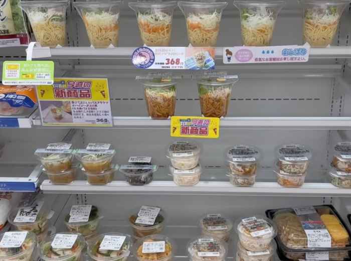 Japanese convenience store shelves with affordable prepared meals