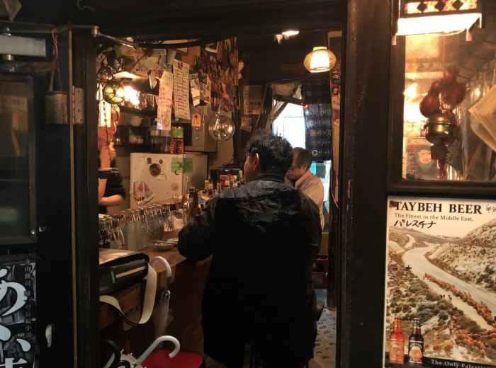 Drinks at a tiny bar in Golden Gai late at night