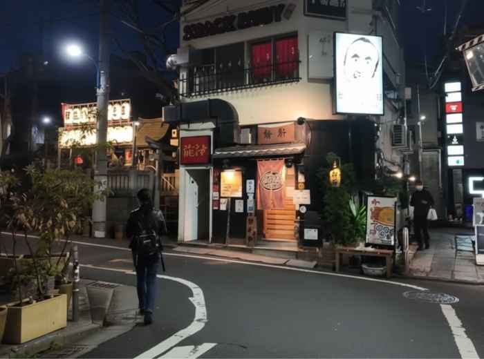 A small, quiet street with a bar late at night in Arakicho, Tokyo