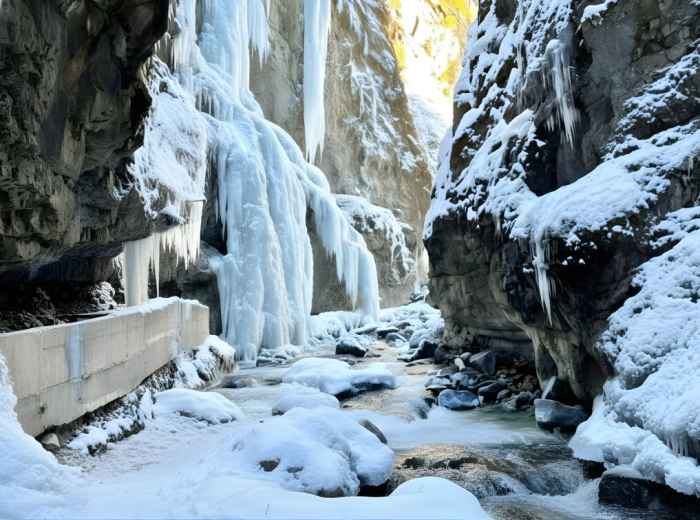 Narrow gorge walls with icy river at Partnachklamm