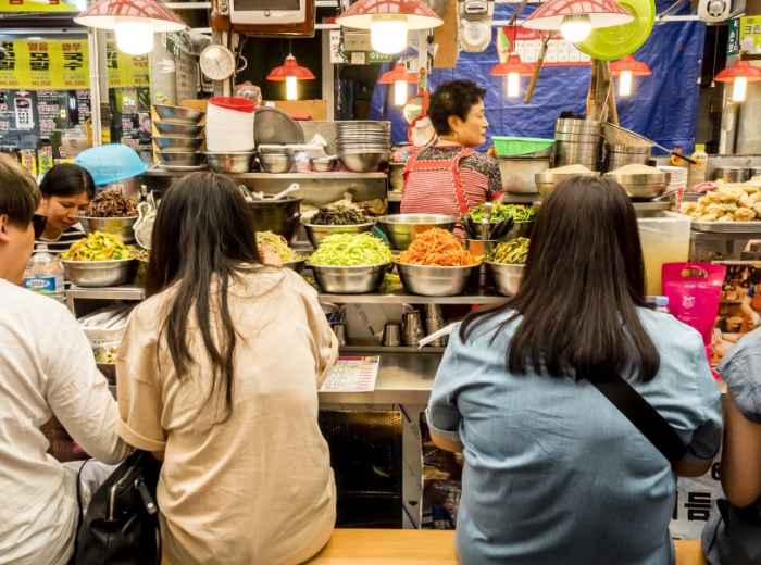Everyday market counter where locals eat simple meals in Seoul