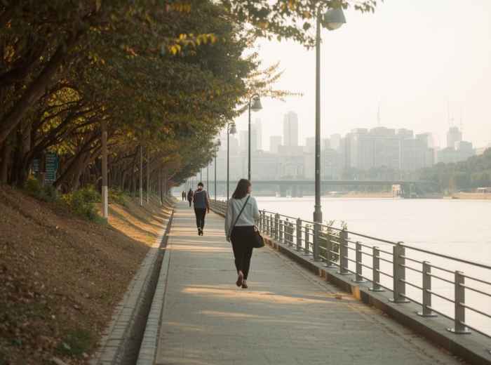 Han River path at sunset with relaxed evening walkers