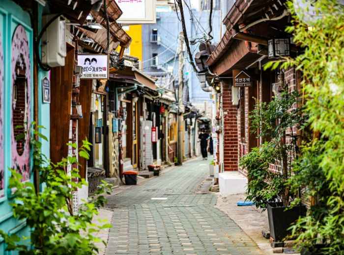 Narrow Ikseon-dong alley with hanok storefronts