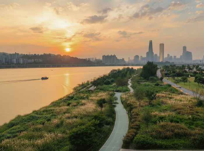 Seoul skyline over Han River at warm May sunset