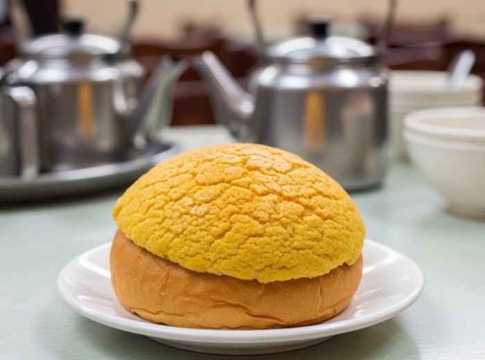 Hong Kong pineapple bun on a small plate in a traditional cha chaan teng
