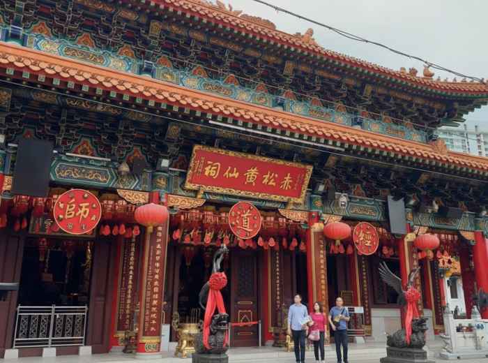 Wong Tai Sin Temple entrance with visitors in Kowloon