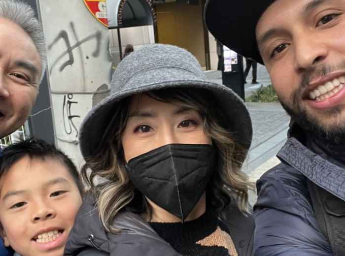Khalid showing a young family the fun and energy of exploring Osaka