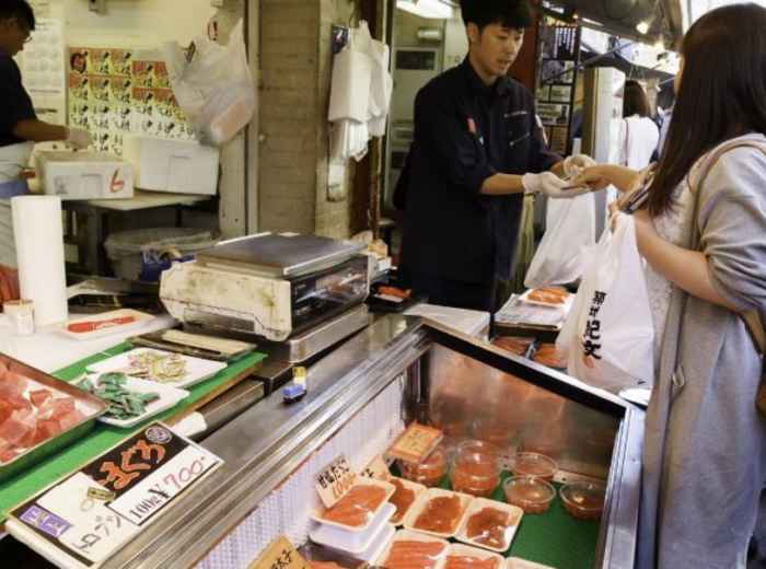 Fresh seafood counters and busy morning lanes at Tokyo’s Tsukiji Market