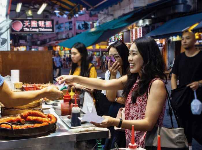 Street food stalls and evening crowds in Hong Kong’s