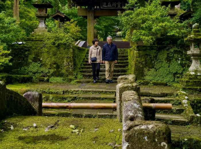 Older couple walking near Gio-ji Temple entrance