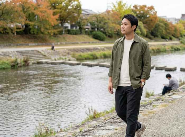 Naoki on a quiet morning walk beside the Kamo River  