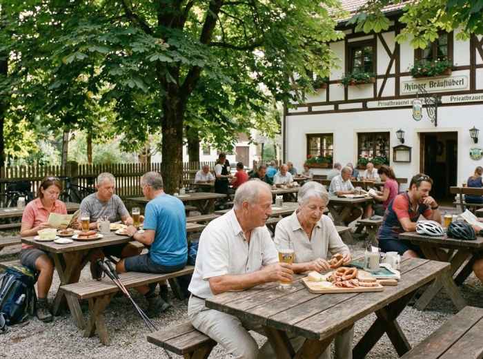 People enjoy lunch beneath chestnut trees at the Ayinger Bräustüberl beer garden 