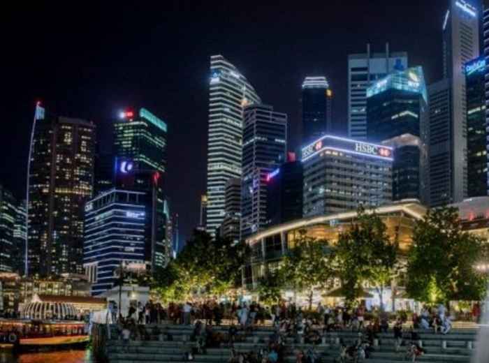 Merlion waterfront with Singapore’s illuminated Marina Bay skyline 