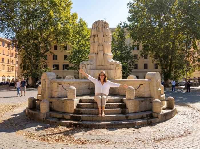 Alessia seated in Piazza Testaccio in Rome 