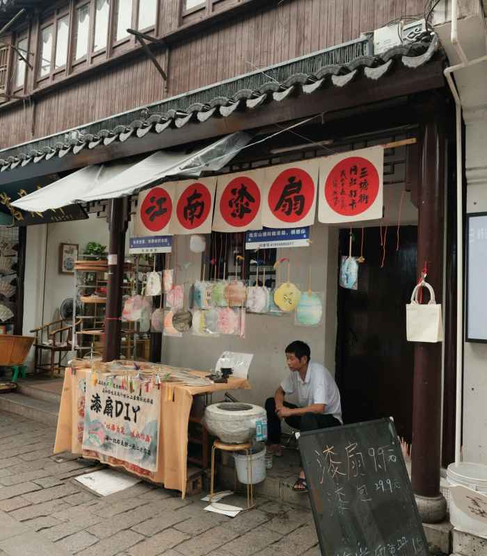 Street-level view of a traditional shop in Osaka, welcoming neighborhood customers with a simple, lived-in charm. Image by Dominic Kurniawan Suryaputra on Unsplash.