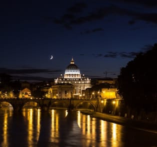 Walk along the Tiber River in the evening